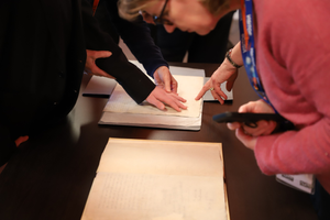 Students touching the original documents.